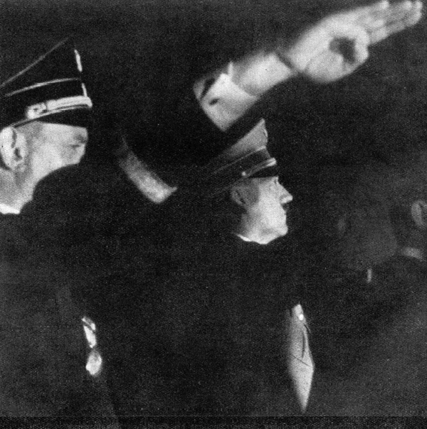 Adolf Hitler salutes the crowd of the Olympic stadium during the closing ceremony of the Berlin Summer Olympics